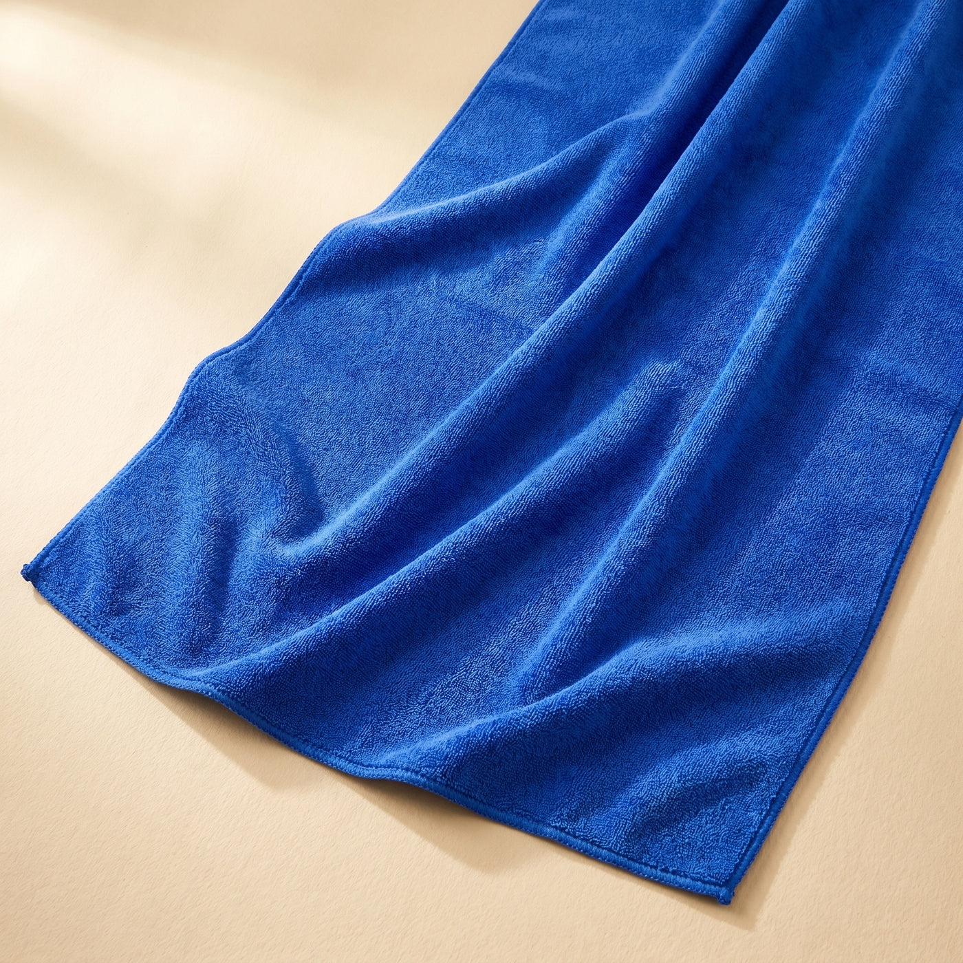 DRIVORA XL Microfiber Drying Towel — partially unfolded blue towel showing 60x160 cm scale